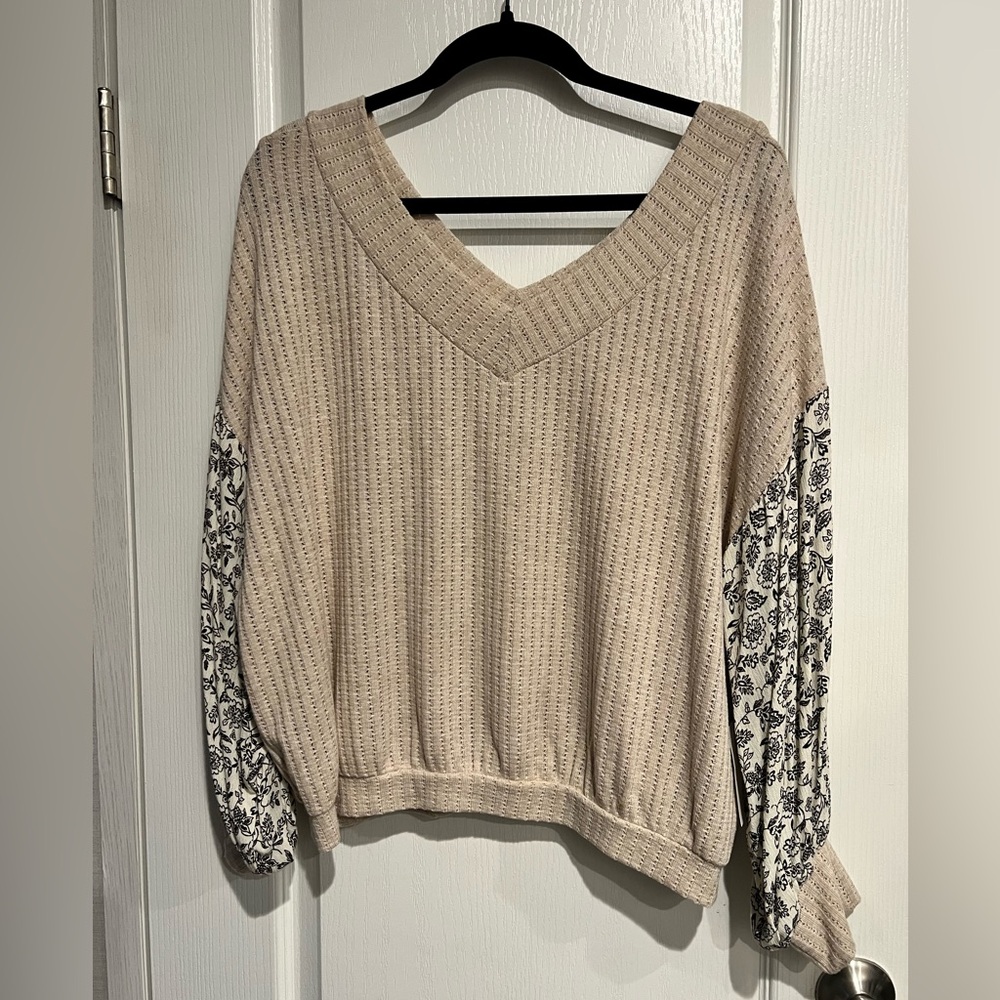 Chic Cream and Black V-Neck Sweater with Floral Print